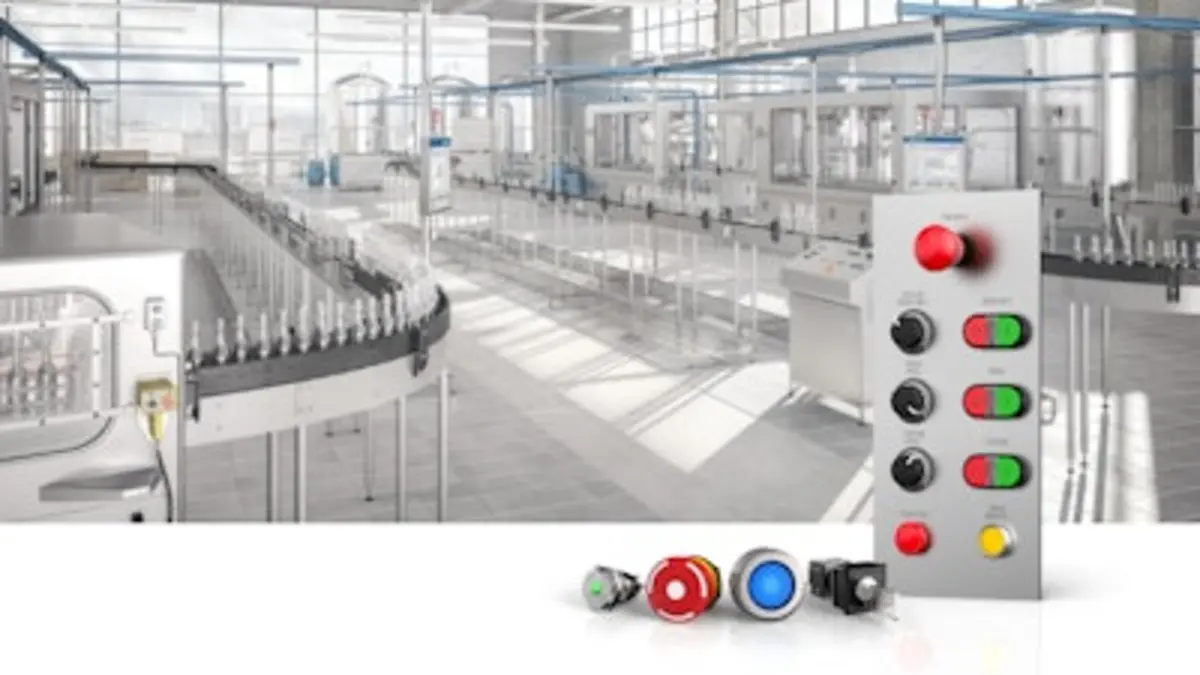 Bright food-processing facility with conveyor lines, stainless machinery, and a control panel with illuminated buttons.