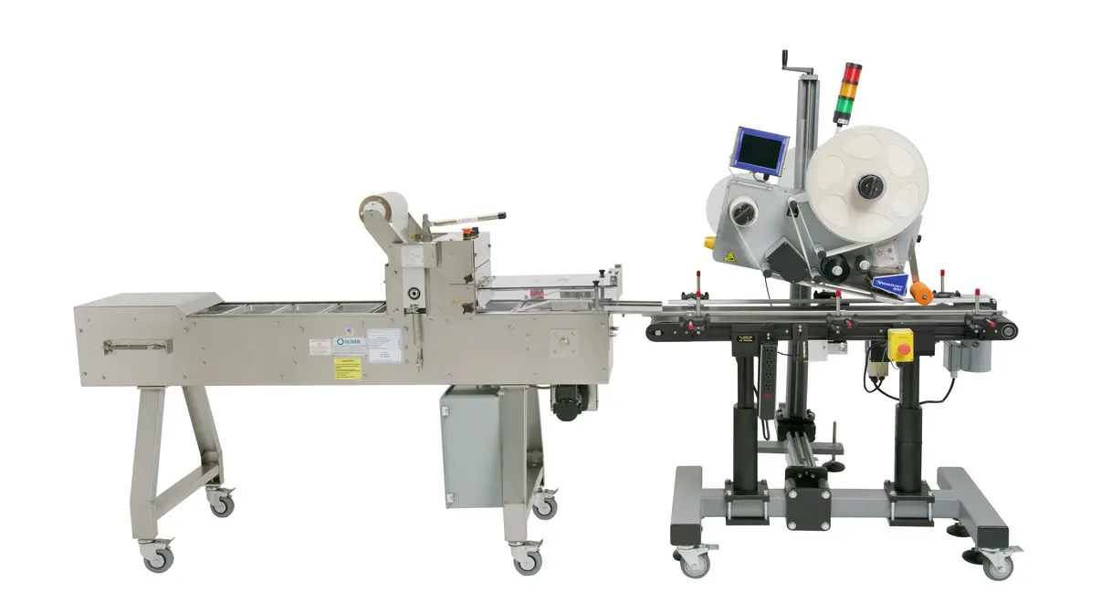 Industrial labeling machine with a conveyor system and printing unit for food products.