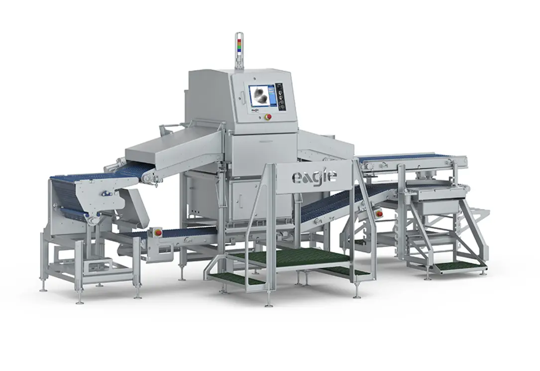 Industrial packaged-food conveyor with an enclosed X-ray inspection unit and touchscreen control panel.