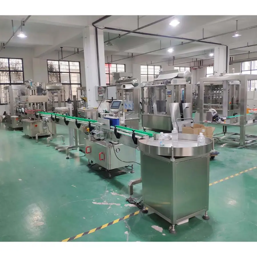 Packaging line featuring various equipment, including bottle unscrambler and conveyor belts in a factory setting.