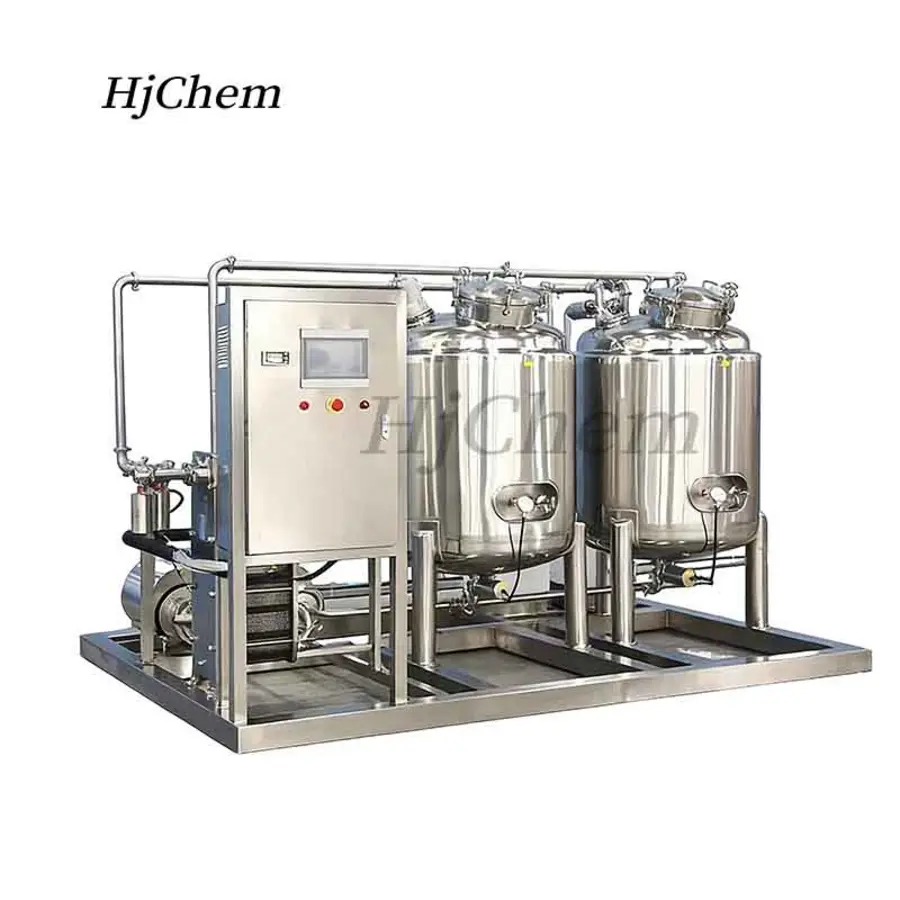 Stainless steel food processing equipment with dual tanks and a control panel.
