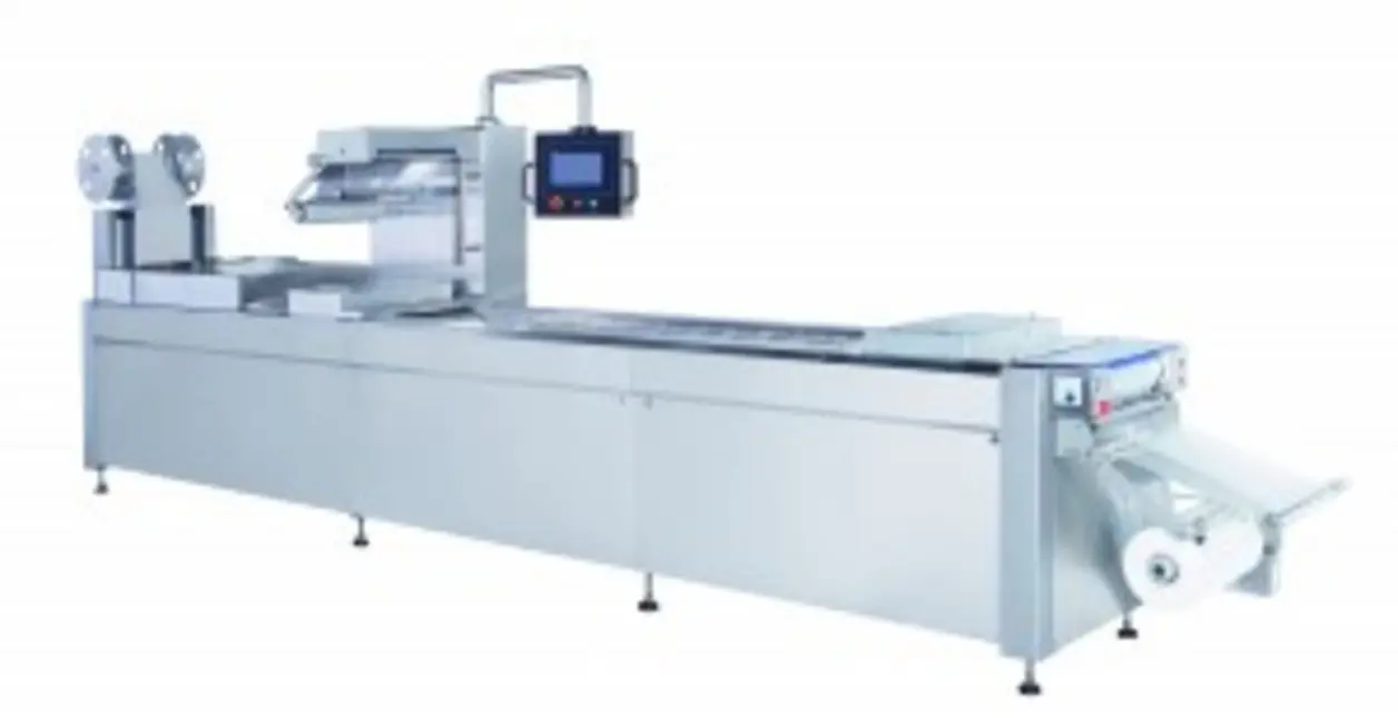 Roll-fed thermoforming machine with a conveyor system and control panel.
