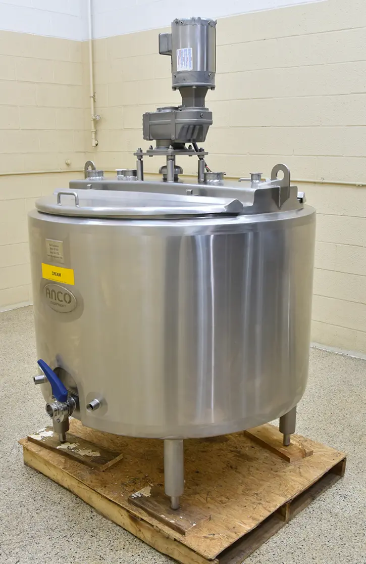 Stainless steel batch pasteurizer tank with a lid and control mechanism.