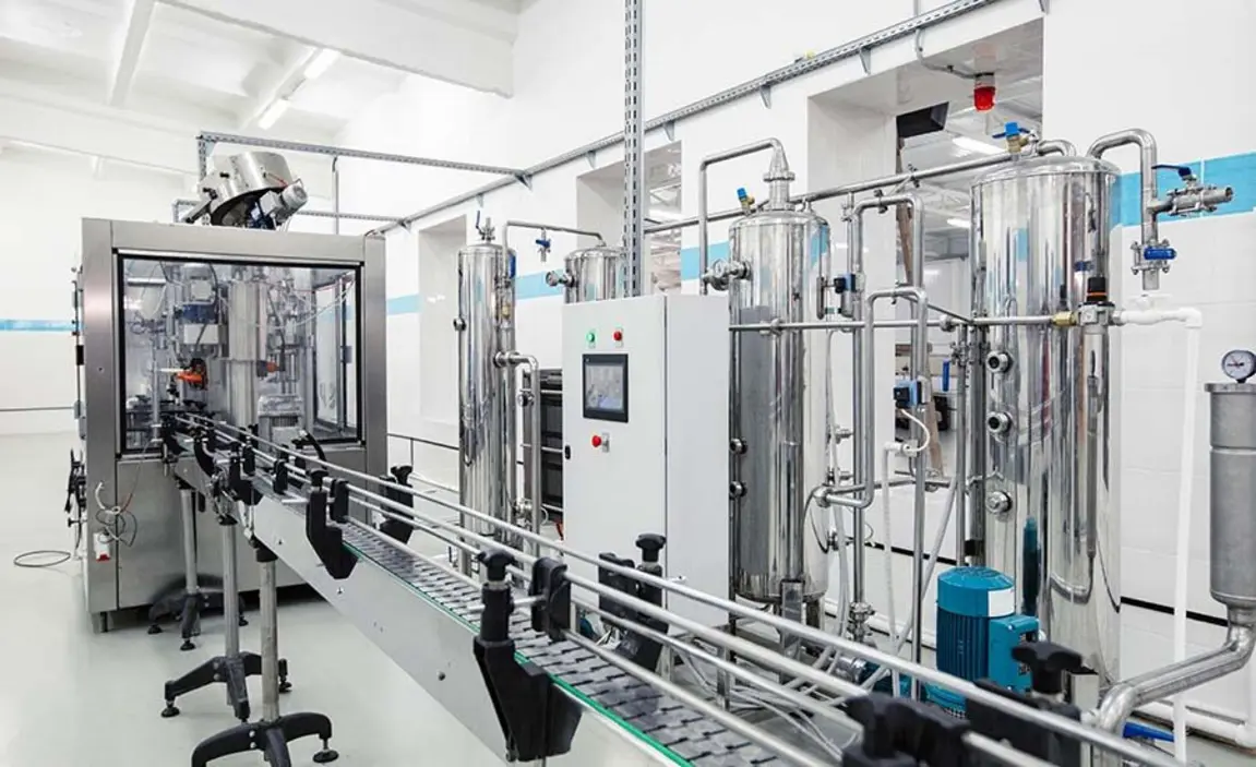 Clean industrial food-processing equipment featuring stainless steel components and a central control unit.